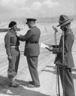 John Blunden receiving his War Medal